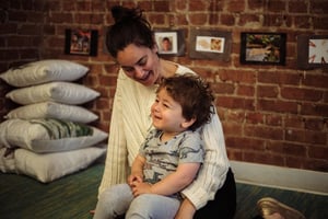 Ariel smiling with one of her Roots students