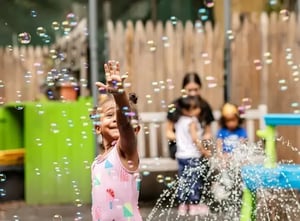 Camp Corlears - 3s having fun with bubbles and sprinkler time
