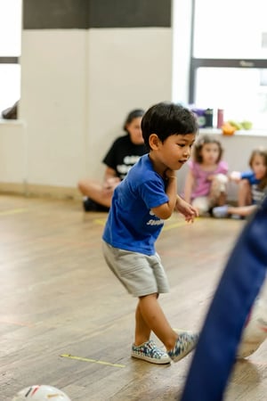 Camp Corlears - a young soccer player flexes their skills