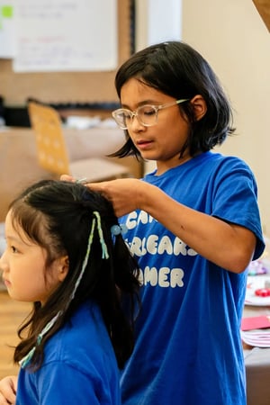 Camp Corlears - braiding hair