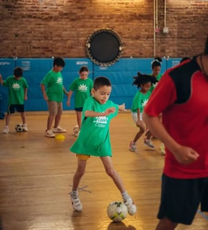 Camp Corlears - older campers playing soccer