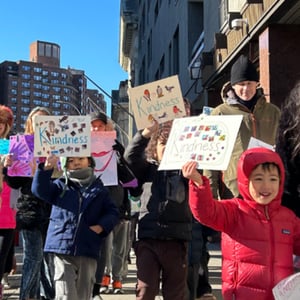 walking along 8th avenue in the march for kindness