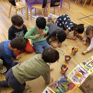 students working on march for kindness signs