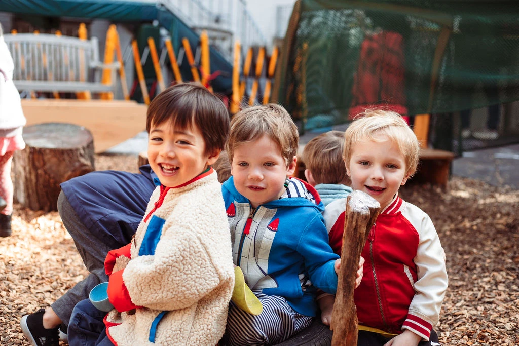 Early childhood students having fun in the backyard Early childhood students having fun in the backyard